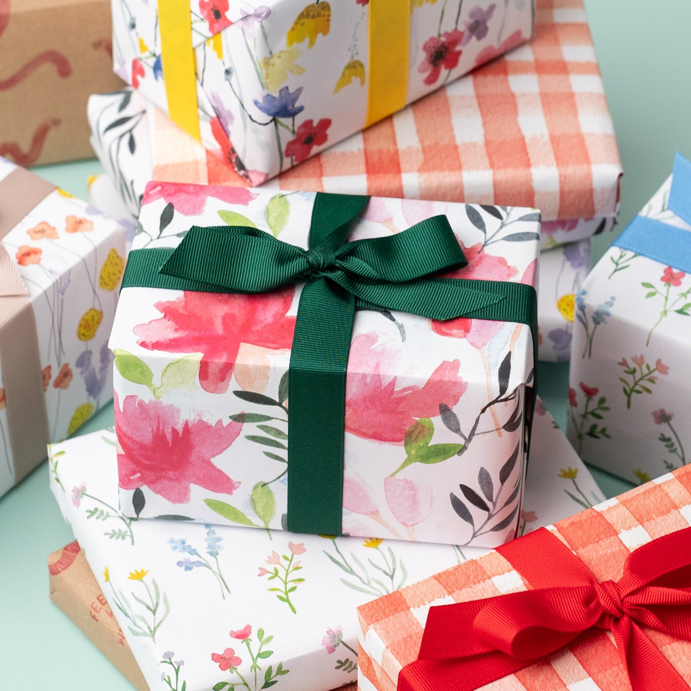 A present wrapped in Ruby & Bo Roses recycled wrap
