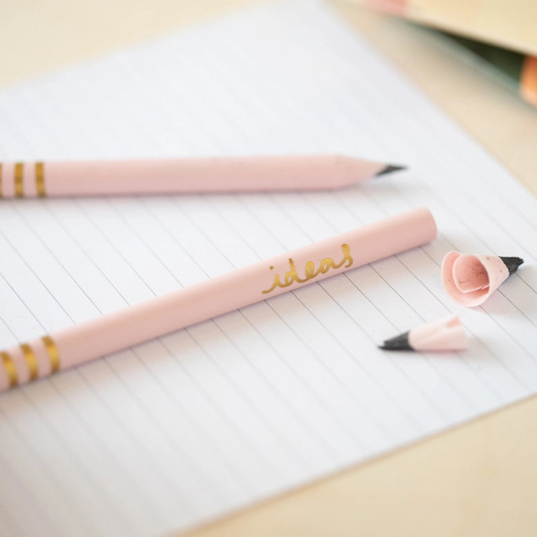 Light Pink recycled pencil on a sheet of lined writing paper