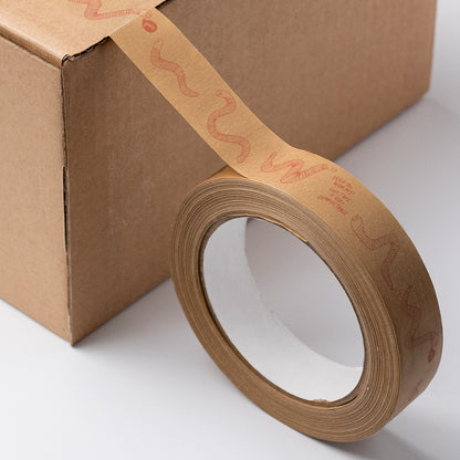 Roll of eco-friendly paper tape featuring delicate worm illustrations, with softly printed pink design and natural paper texture
